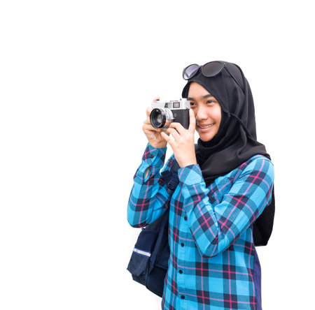 A Muslim girl listened to music with headphones.の写真素材