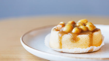 Macadamia cake close up on wooden tableの写真素材