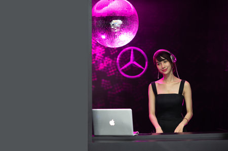 Blur Bangkok, Thailand  - April 06 2018 Unidentified model  Play music with violin and music from computer show in Bangkok International Motor Show in Bangkok, Thailandのeditorial素材