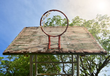 Basketball court  with old wood backboard.blue sky and white clouds on background. Old Basin Stadiumの写真素材