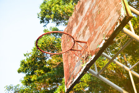 Basketball court  with old wood backboard.blue sky and white clouds on background. Old Basin Stadium.の写真素材