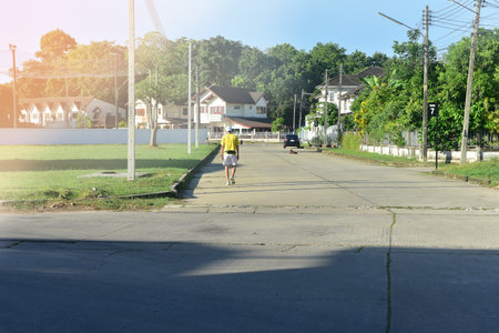 Rayong,Thailand July 14 2021 Unidentified girl riding bicycles on the village road in the morningのeditorial素材