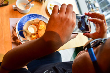 Bangkok Thailand August 03 2019 Blur Delicious salmon fish roasted steak in blue plate. with fresh vegetable Salad. grilled steak.の写真素材