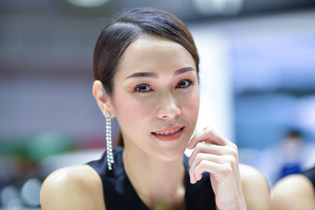 Bangkok Thailand August 24 2019 blur Unidentified Pretty is presenting a car for sale at the Bangkok Motor Showのeditorial素材