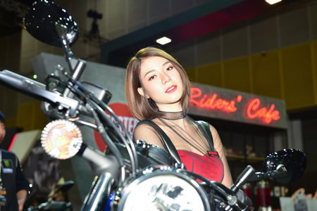 Bangkok Thailand August 24 2019 blur Unidentified Pretty is presenting a motorcycle for sale at the Bangkok Motor Showのeditorial素材