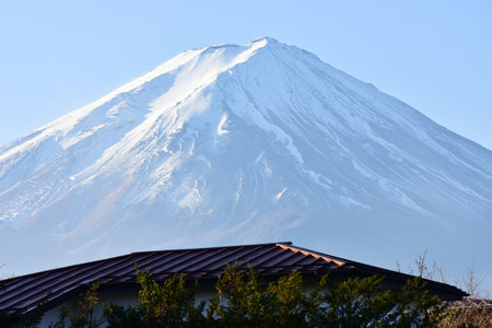 The first sunrise of Mount Fuji blue is covered with white snow in the morning.の写真素材