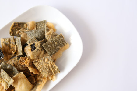 Crispy seaweed cracker isolated on a white background