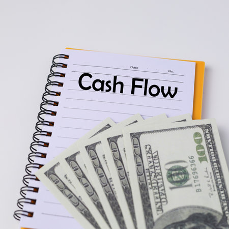 Top view of a money with text Cash flow written on a notebookの素材 [FY310165356278]