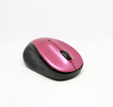 Pink and black mouse isolated on a white backgroundの写真素材