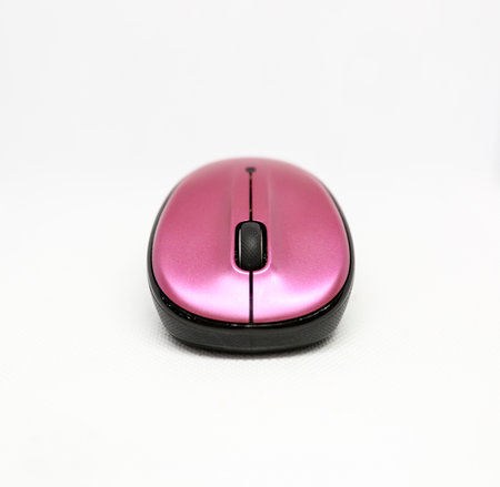 Pink and black mouse isolated on a white backgroundの写真素材