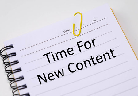 Time for new content phrase written in the notebook.の写真素材