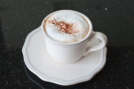 Mocha Coffee cup  on black marbleの写真素材