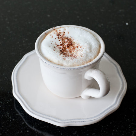 Mocha Coffee cup  on black marbleの写真素材