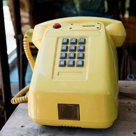 vintage orange telephoneの写真素材