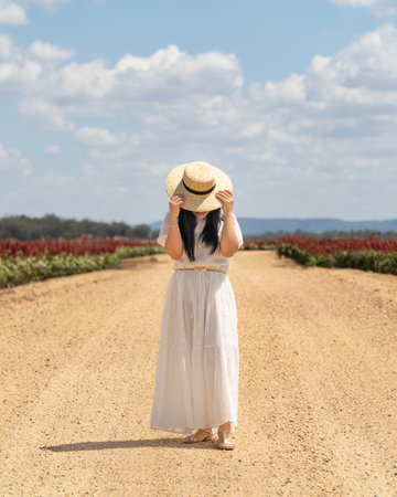 woman in hat in countrysideの写真素材