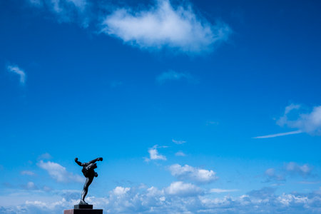 A statue against a blue dkyのeditorial素材