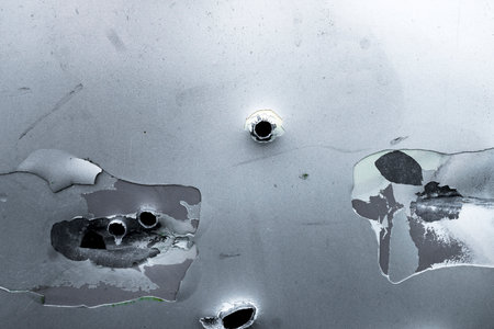 A door on a car full of bullet hole.の写真素材