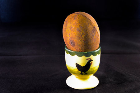 An artificial egg in an egg cupの写真素材