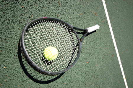 Tennis racquet and ball