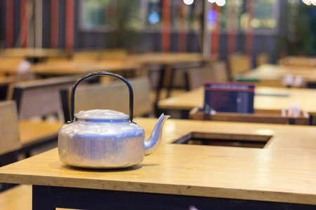 A soup jug is placed on the table.