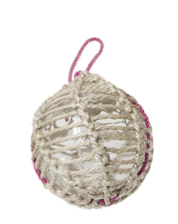 Glass fishing buoy used to keep fishing nets floating. This is an old glass antique. Isolated on white background.の写真素材