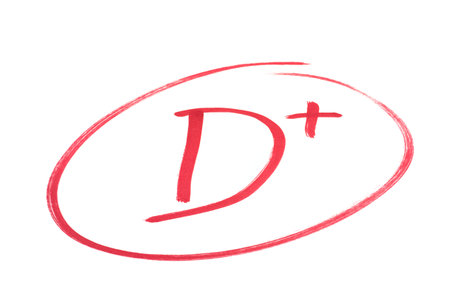 A handwritten grade for not bad achievementsin red ink  Isolated on white の写真素材