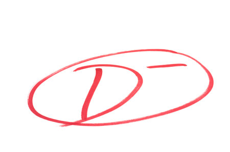 A handwritten grade for not bad achievementsin red ink  Isolated on white の写真素材