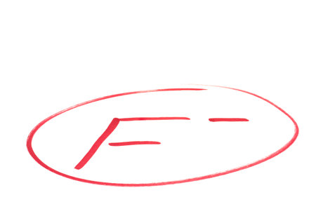 A handwritten grade for failed achievements in red ink  Isolated on white の写真素材