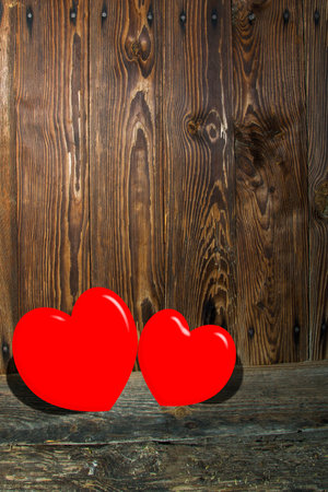 Two hearts on a wooden sceneの写真素材