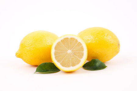 Fresh lemons with sliceの写真素材