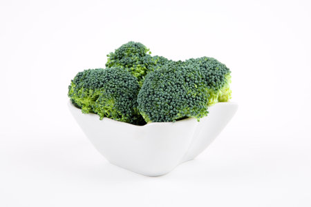 Fresh broccoli in a porcelain bowlの写真素材