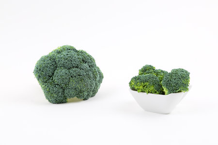 Fresh broccoli in a porcelain bowlの写真素材
