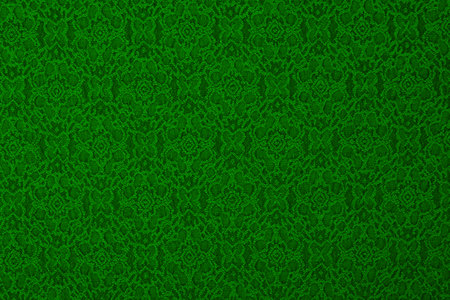 Green material with flowers, a textile background 