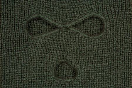 Green abstract background, a balaclava mask の写真素材