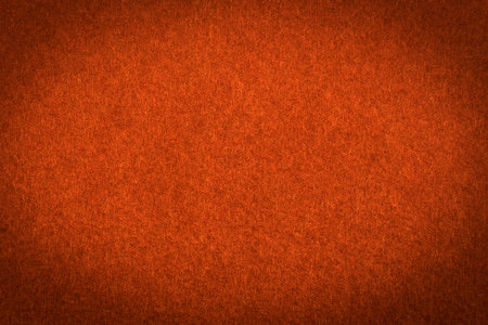 Orange paper with vignette, a background or textureの写真素材