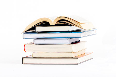 Pile of books on a white backgroundの写真素材