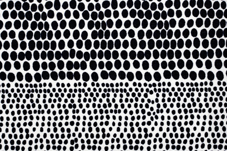 White material in black dots, a background or textureの写真素材