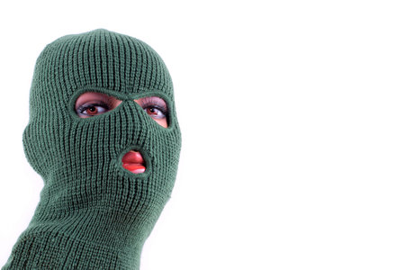 Green balaclava mask on manikins headの写真素材