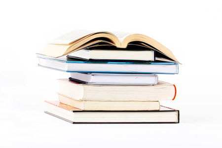 Pile of books on a white backgroundの写真素材
