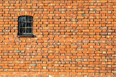 Window on the wall with bricksの写真素材