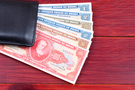 Old Brazilian money in the black walletの写真素材