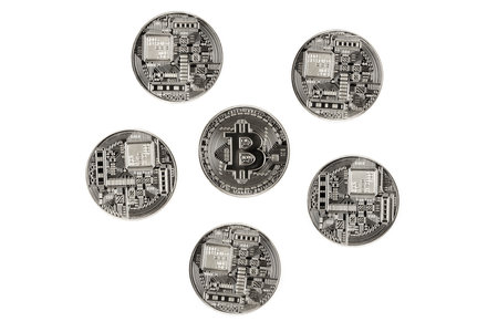 Silver Bitcoins on a white backgroundの写真素材