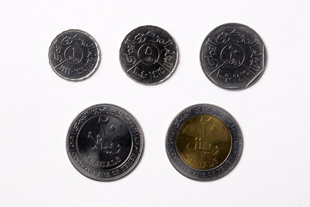 Yemeni coins on a white backgroundの写真素材