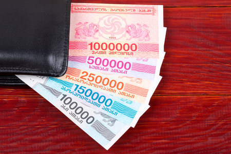 Old Georgian money in the black walletの写真素材