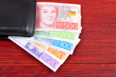 Money from Sweden in the black walletの写真素材