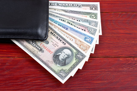 Old money from Mexico in the black walletの写真素材