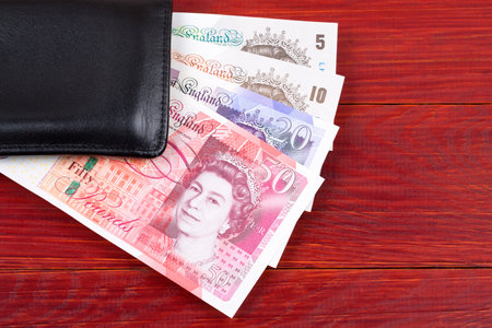 British Pounds in the black walletの写真素材