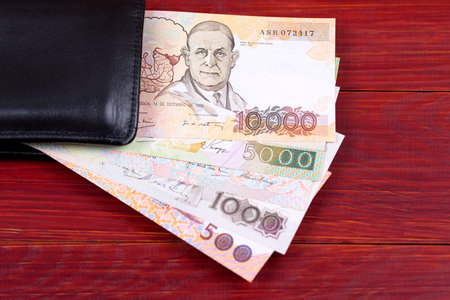 Old Portuguese money in the black walletの写真素材