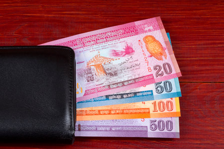 Sri Lankan money in the black walletの写真素材