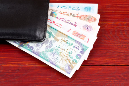 Algerian money in the black walletの写真素材